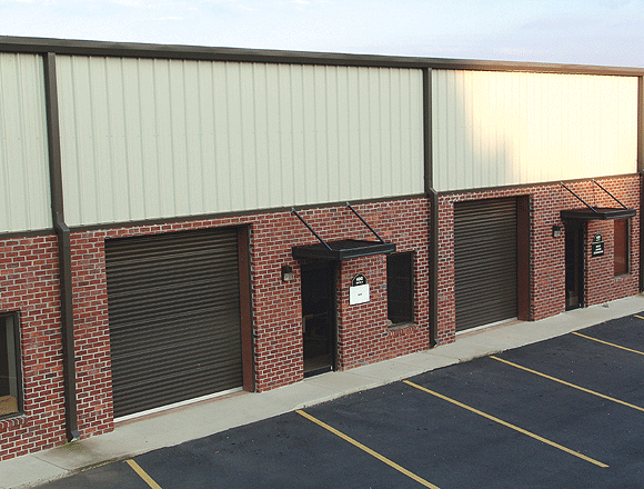 A long shot of Rolling sheet doors of storage units
